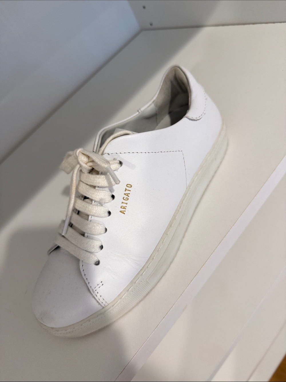Axel Arigato White Leather Low-Top Sneaker with Gold Logo